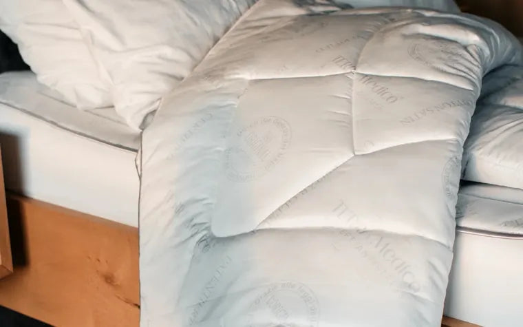 Il piumino anti-stress trapuntato BETTER³ su un letto
